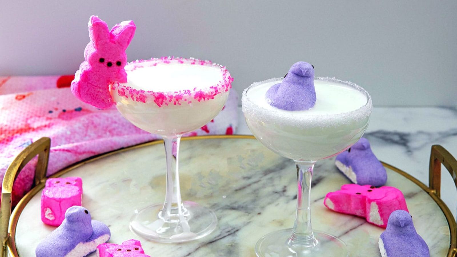 Peeps cocktails in a glass with bunny and bird beside.