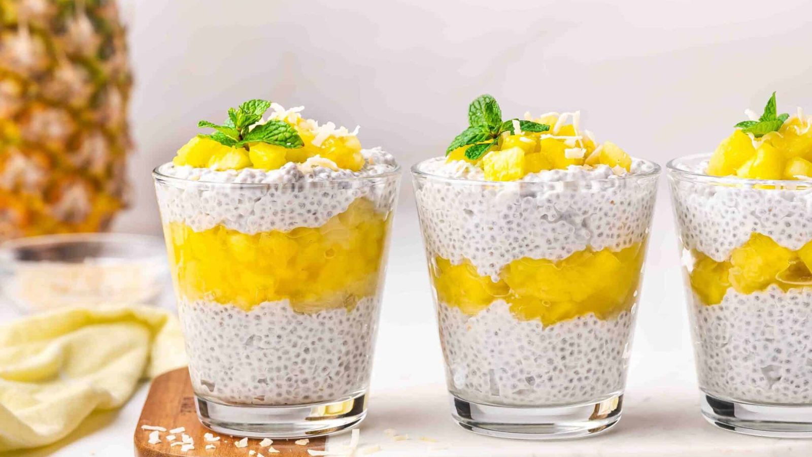 Pineapple coconut puddings on a glass.