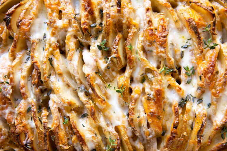 Cheesy potatoes in a casserole dish.