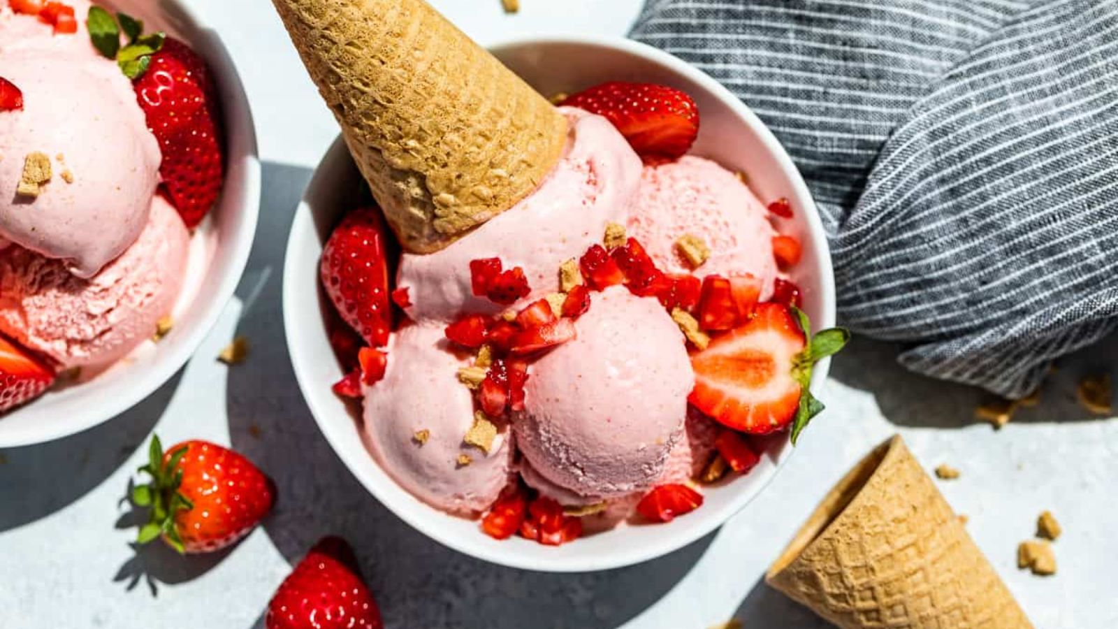 Strawberry cheesecake ice cream in a glass.