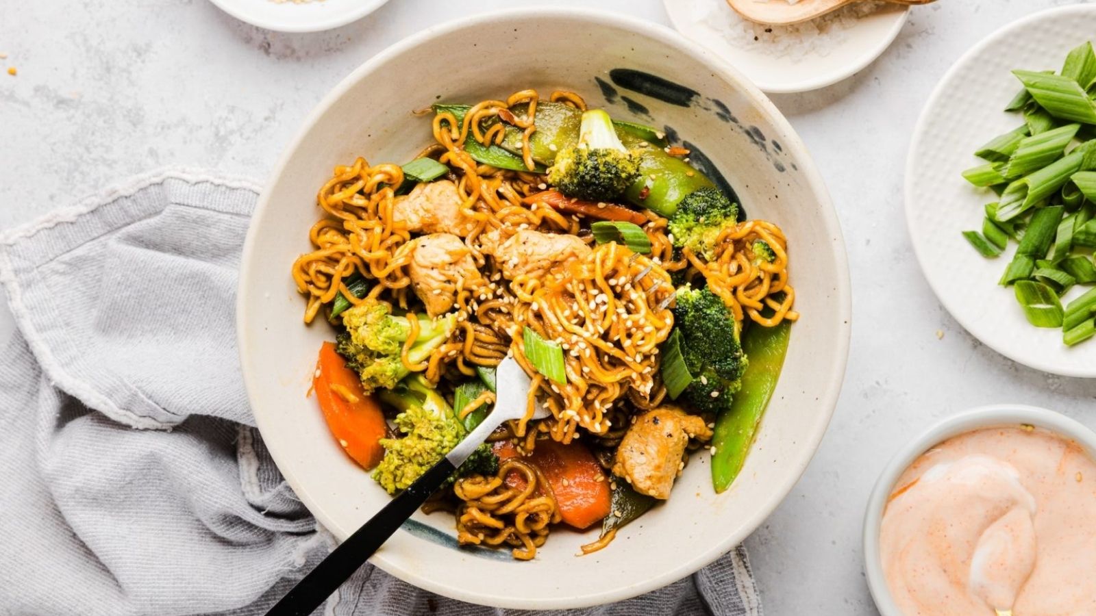 Teriyaki chicken noodles in a bowl.