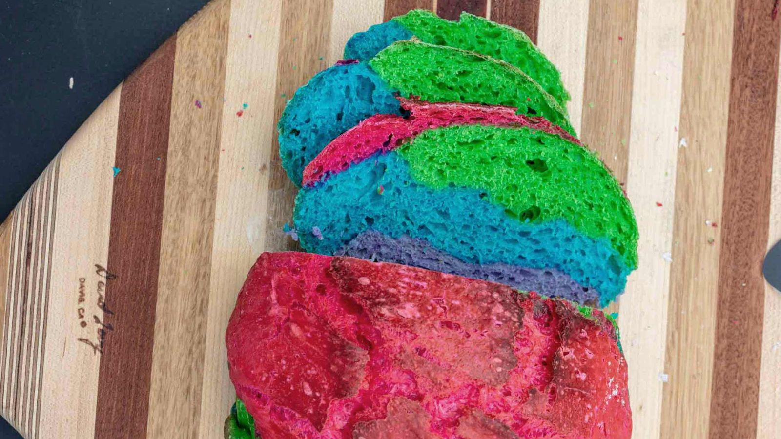 Sliced rainbow cake.
