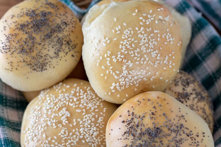 Hamburger buns in a basket.