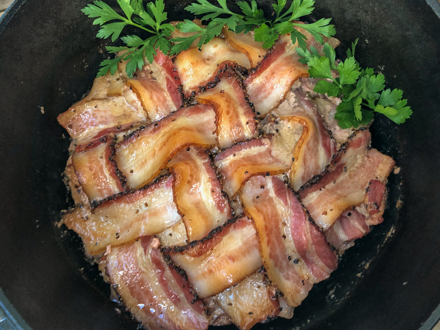 Bacon covered round meatloaf.