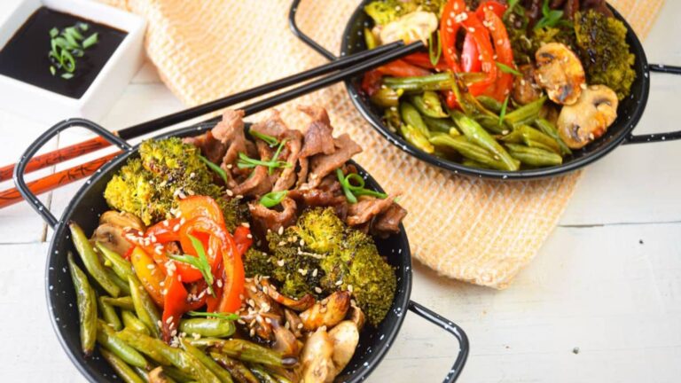 Beef and brocolli on a small wok.