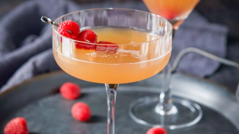 French martini cocktail with raspberry on side.