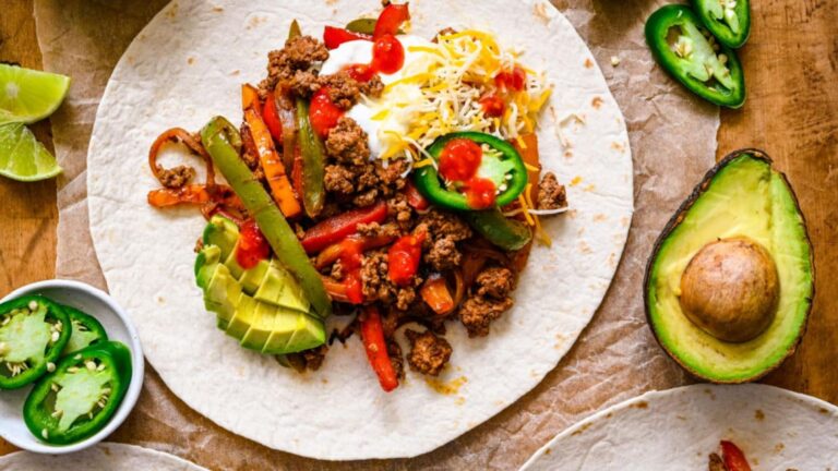 Ground beef fajitas on a tortilla wrap.