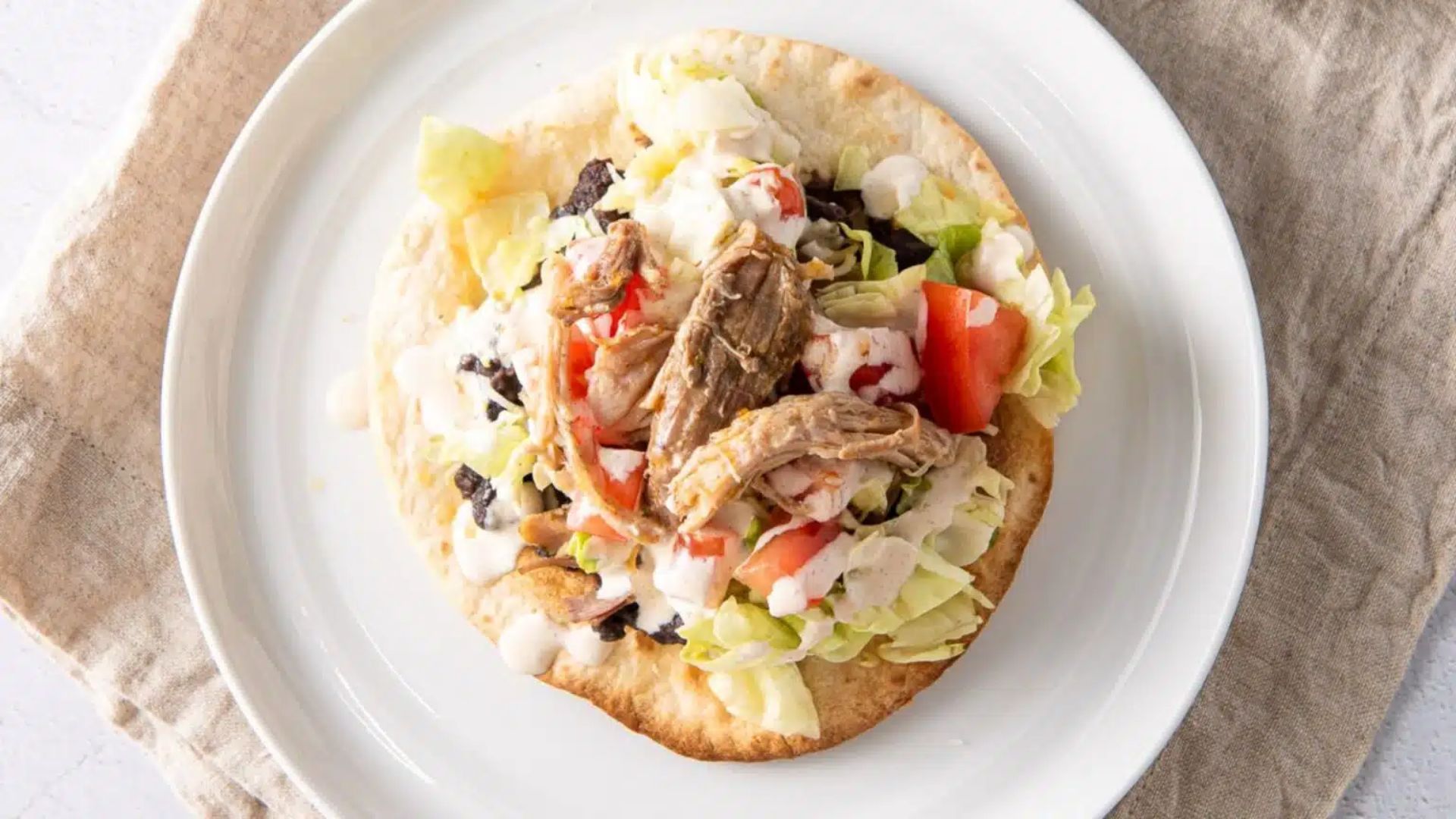 top view shot of pork tostadas on a plate.