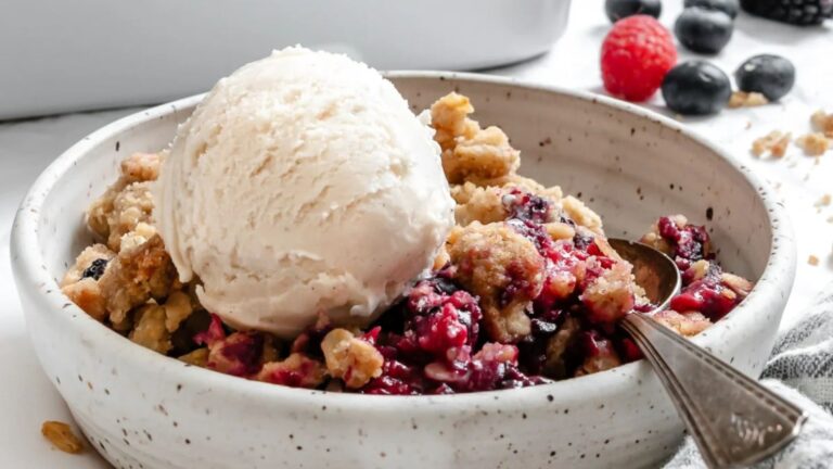 Berry crisp with ice cream on top.