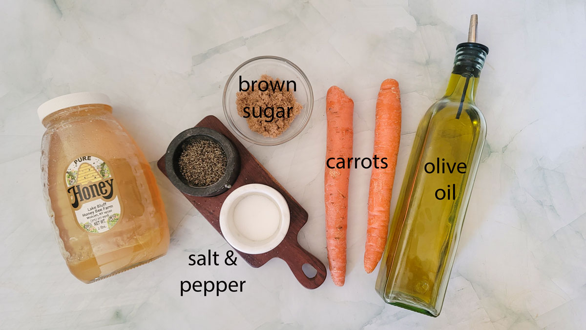 Ingredients to make honey roasted carrots. See details in the recipe below.