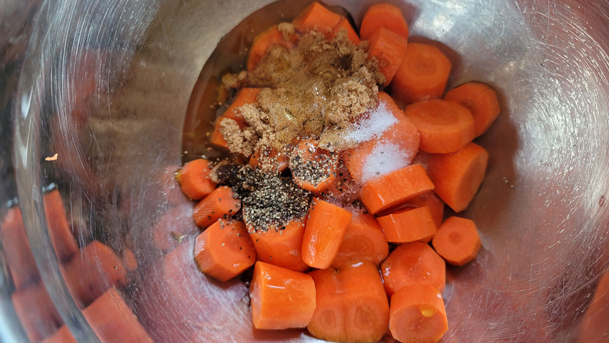 All ingredients in a bowl with the carrots.