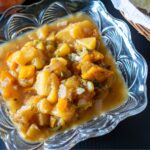 Peach salsa in a glass bowl.