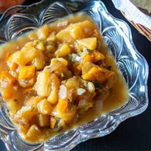 Peach salsa in a glass bowl.