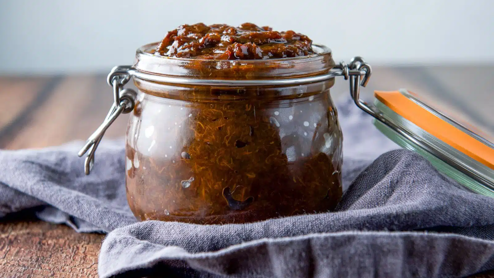Jar teeming with prune spread.