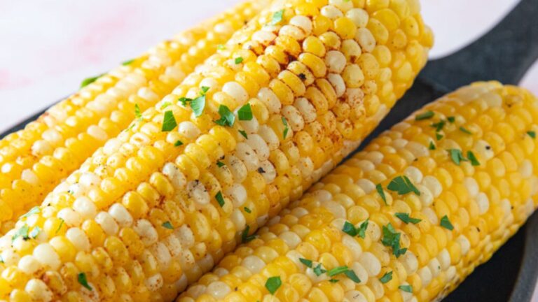 Smoked Corn on the cob on a cast pan.