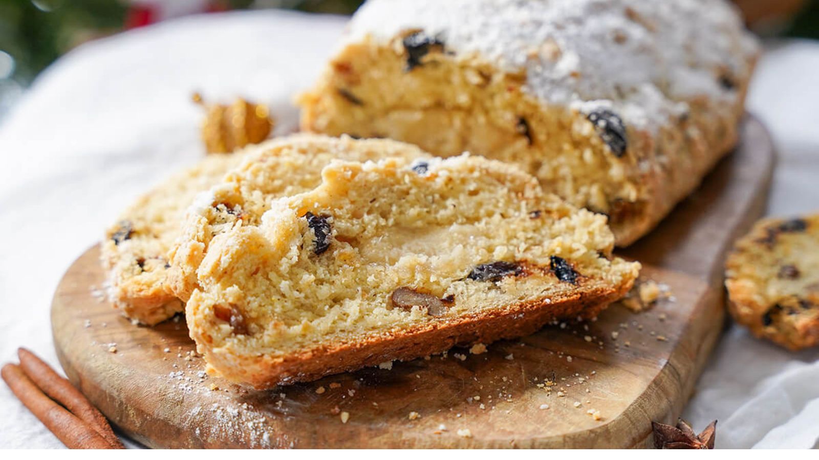 Sliced stollen on a cutting board.