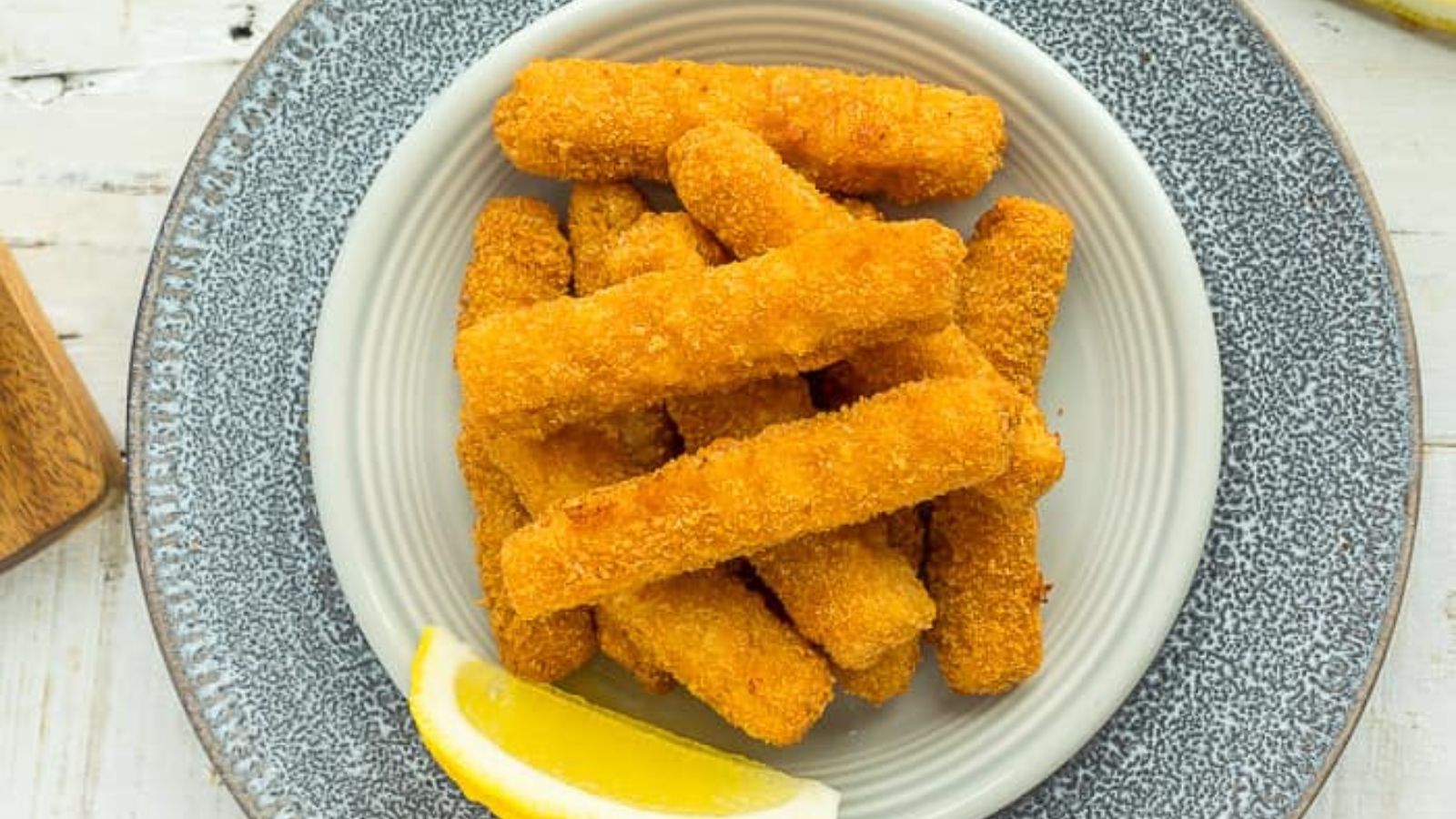 Fried fish sticks on a plate.