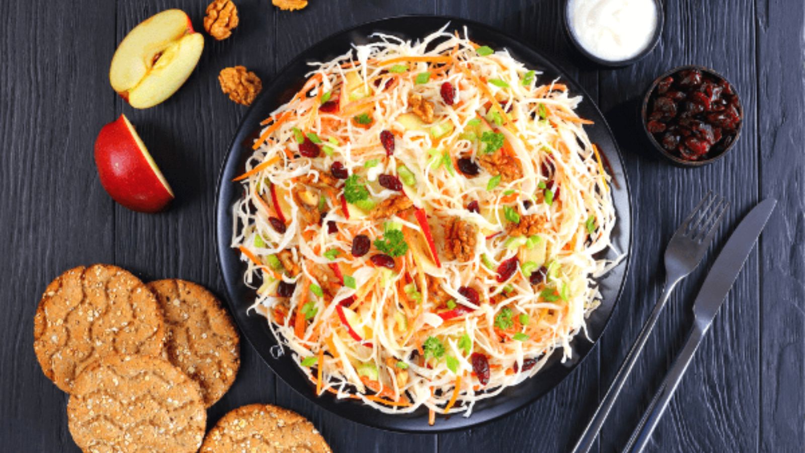 Top view shot of Apple Cranberry Coleslaw on a plate.