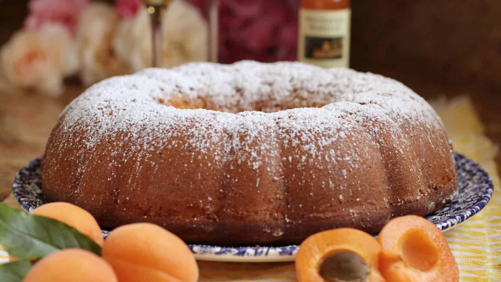 Apricot Cake with apricot in front on a plate.