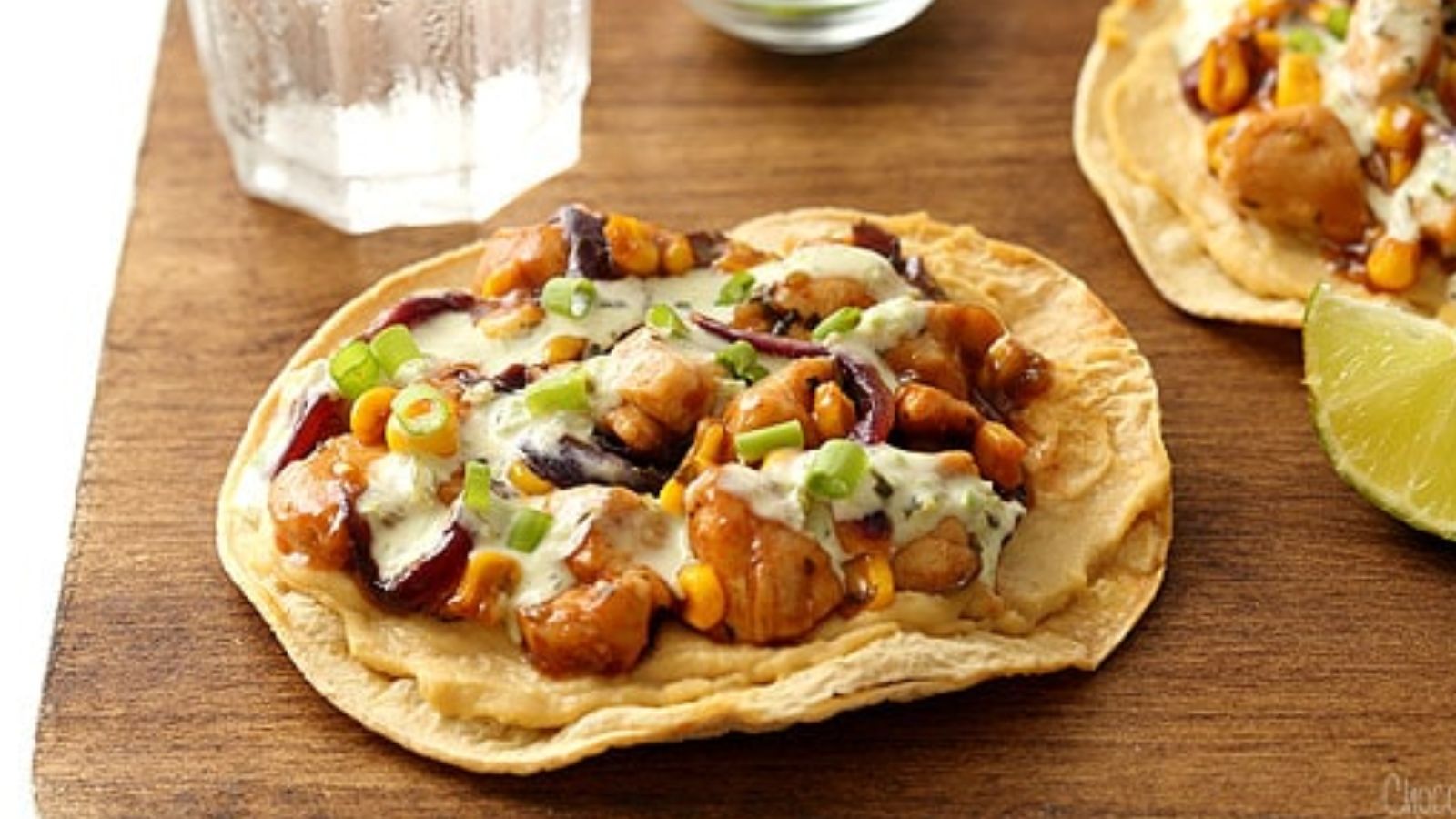 BBQ Chicken Tostadas on a wooden board.