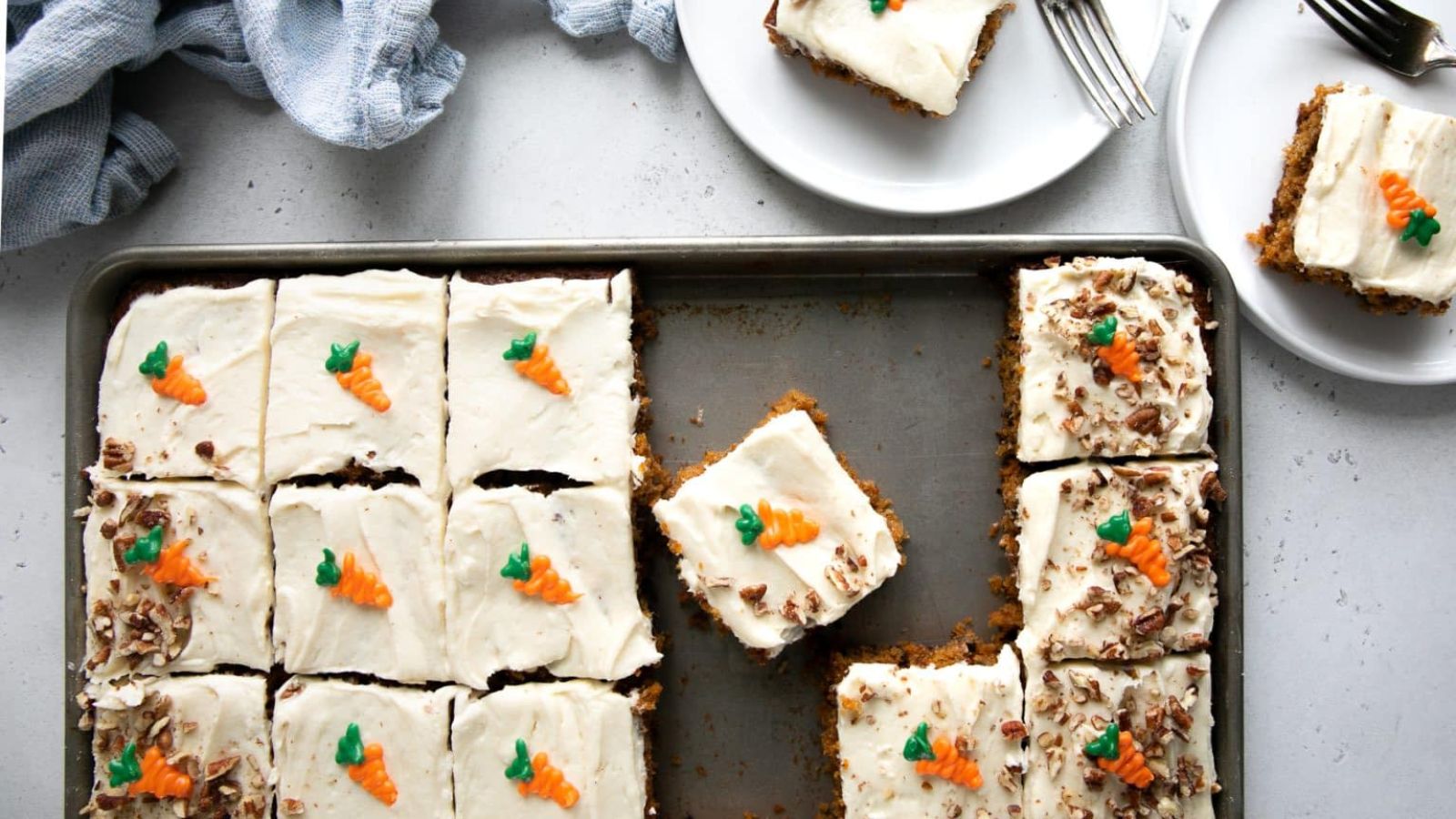 Sliced Carrot Sheet Cake on a tray.