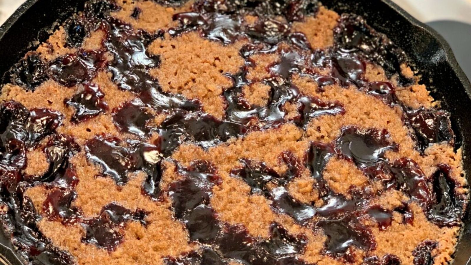 Close up shot of Cast Iron Cherry Cobbler.