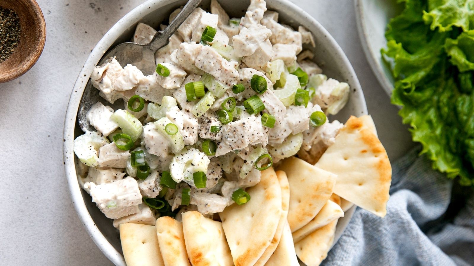 Chicken salad with pita on a bowl.