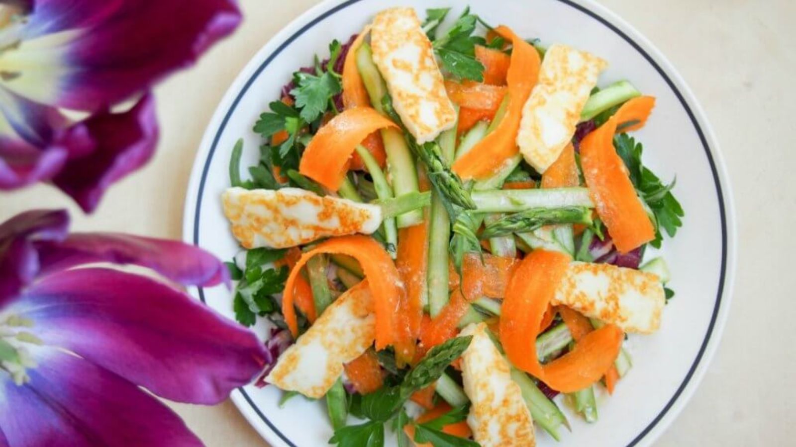 Top view shot of Halloumi, herb and shaved vegetable salad