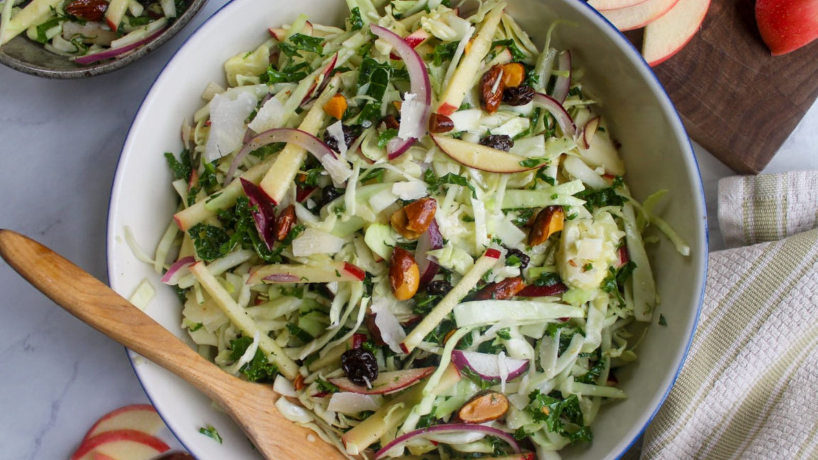 top view shot of Kale Apple Slaw Salad with Honey Apple Cider Vinaigrette on a bowl.