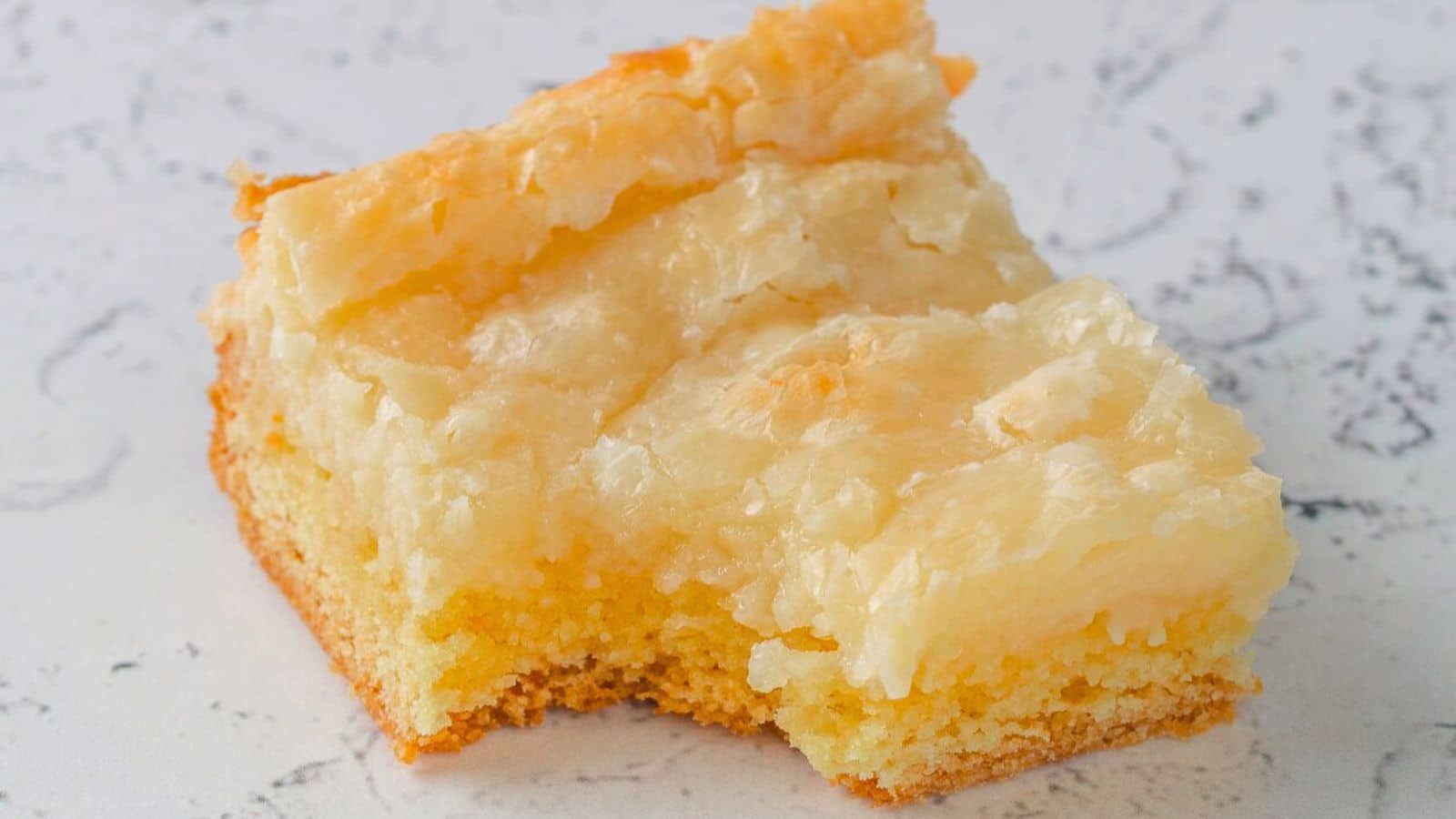 A slice of butter cake with bite.