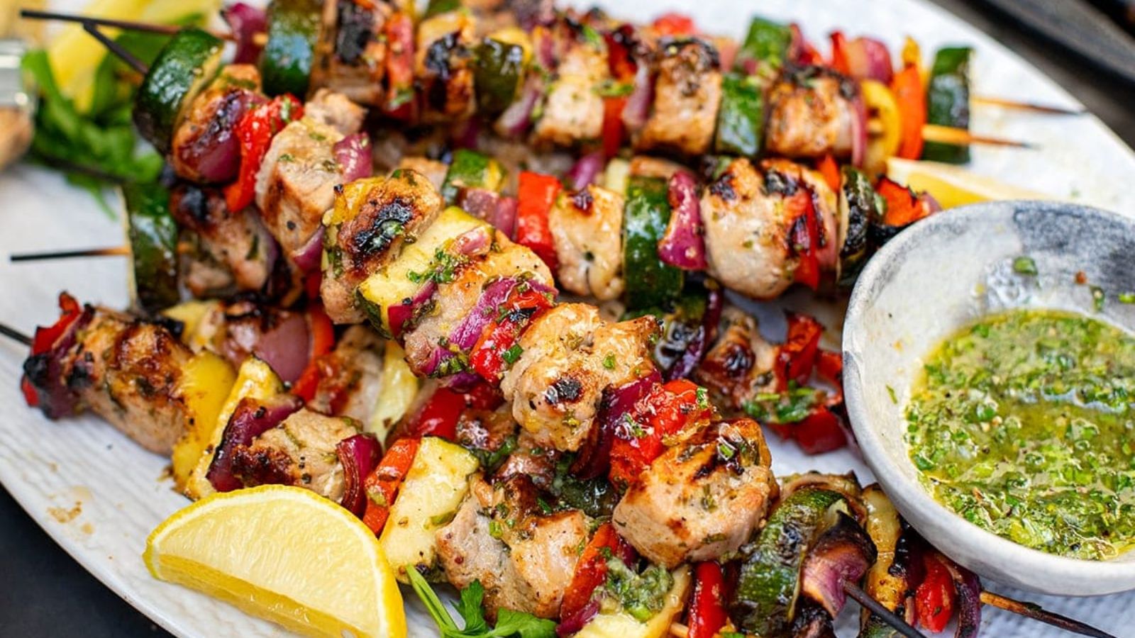 Pork skewers on a plate.