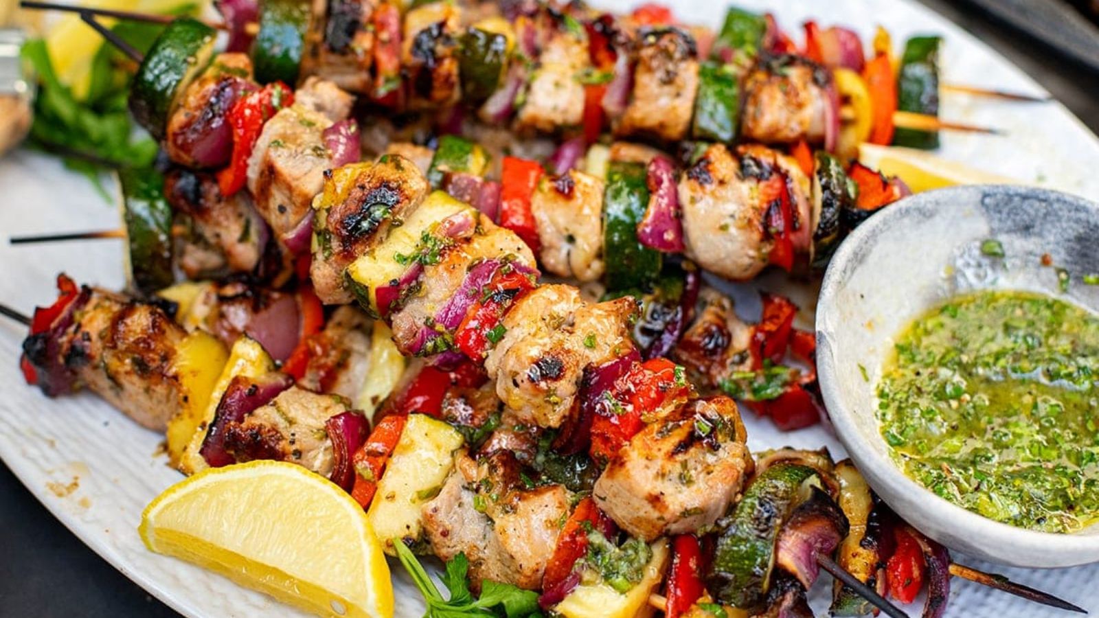 Pork skewers on a plate.