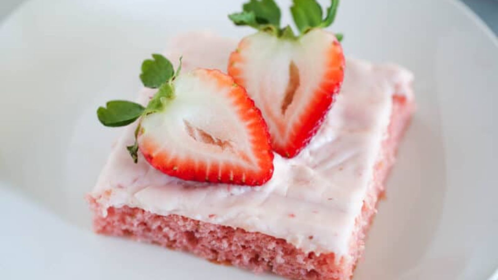 Close up shot of Strawberry Sheet Cake on a plate.