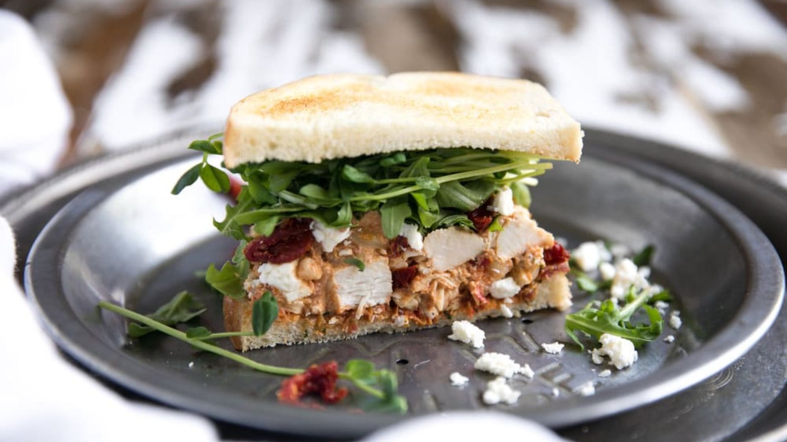 Sun-Dried Tomato Pesto Chicken Salad Sandwich on a plate