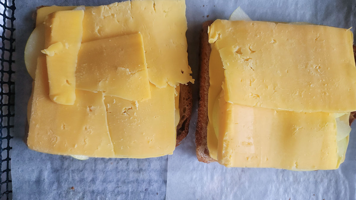 Cheddar cheese added to the top of the apples.
