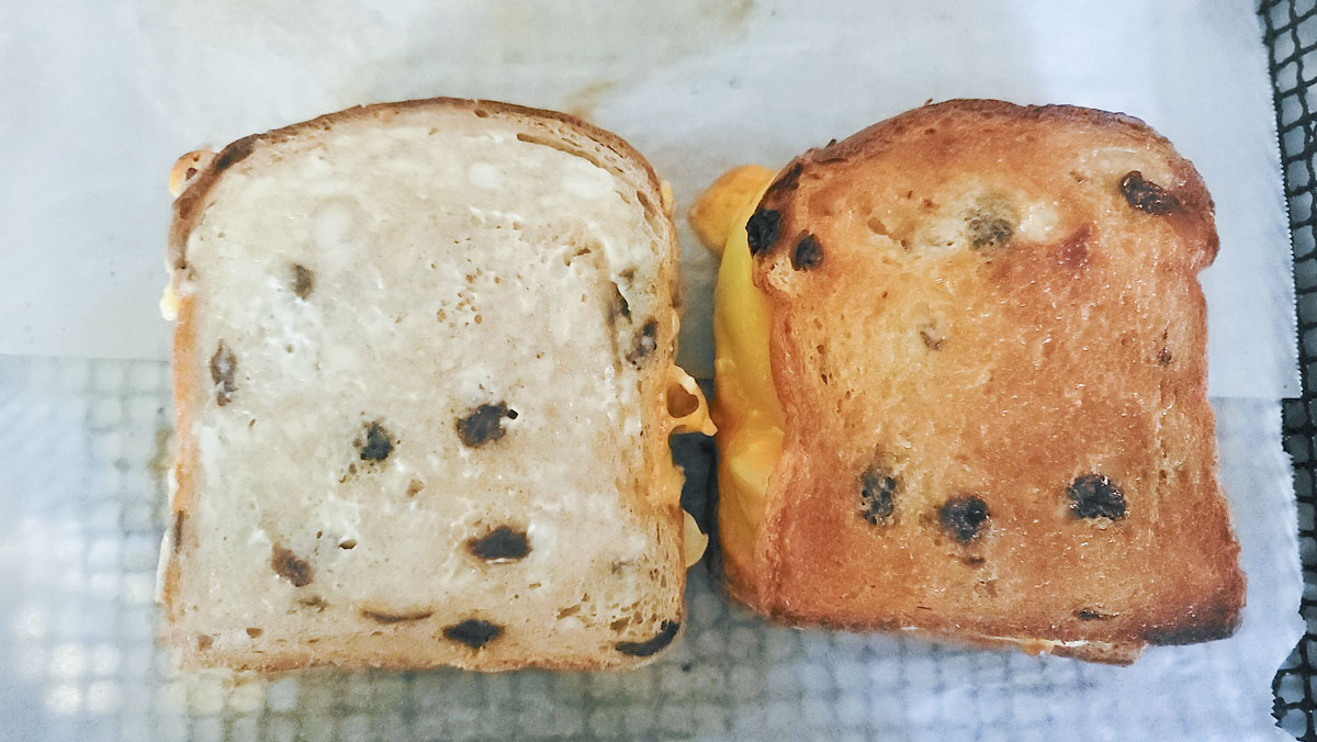 One sandwich flipped over to see the browned side and the unbrown side.