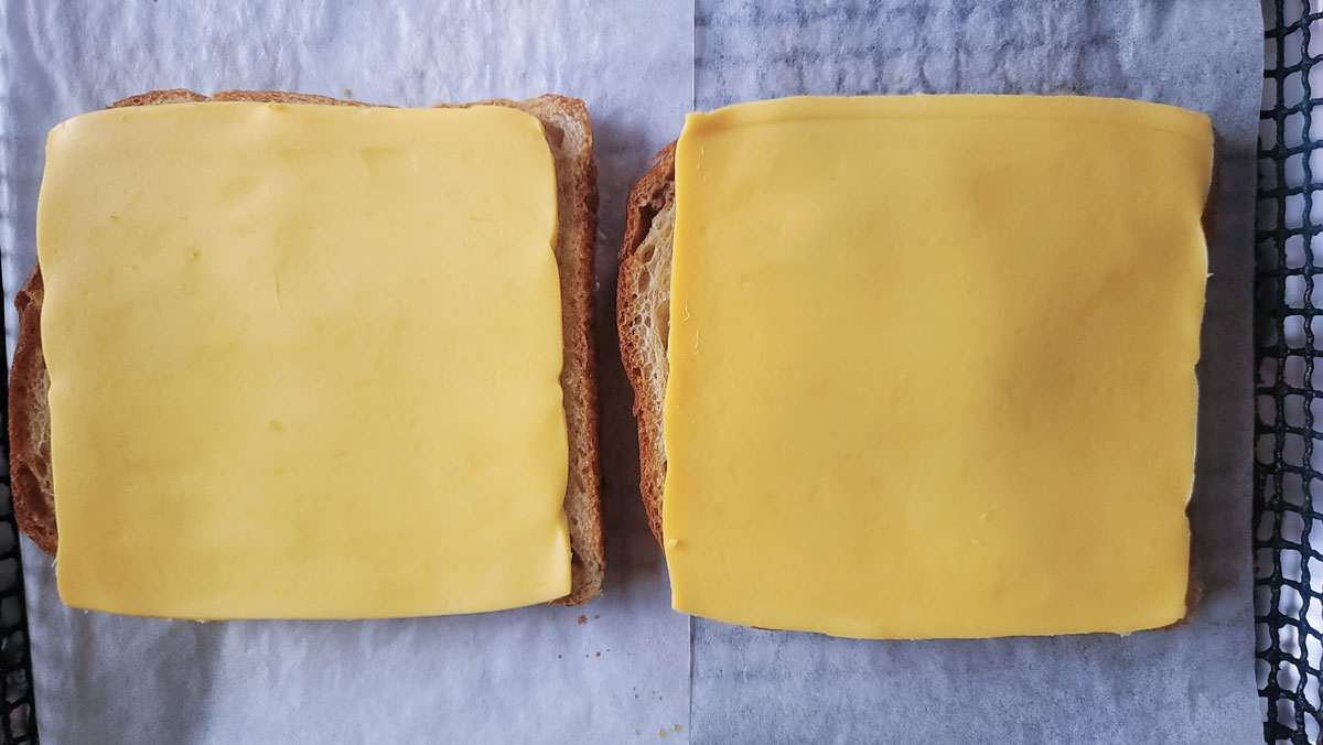 American cheese placed on the dry side of the bread.