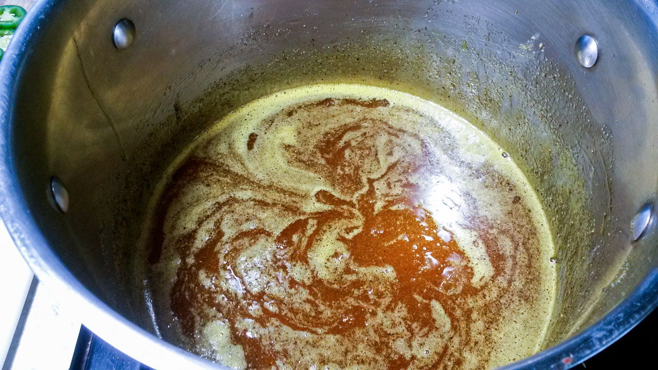 Brine ingredients added to a large stockpan.
