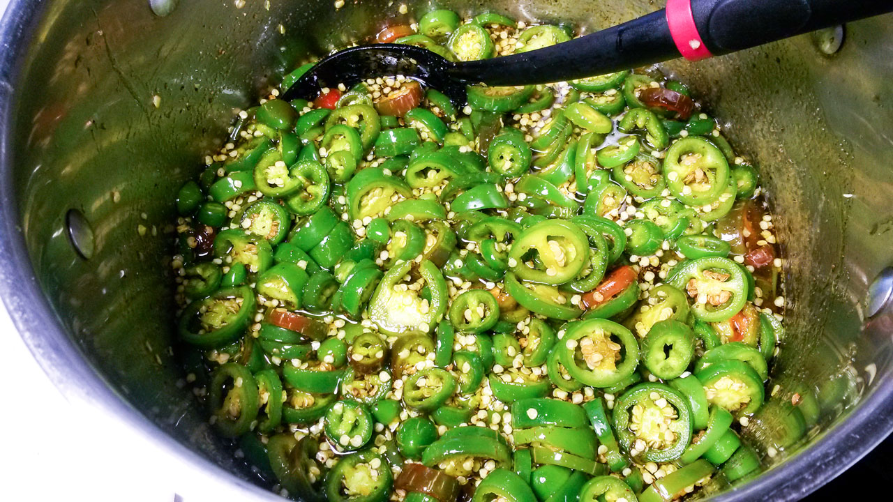 Peppers added to the hot brine.
