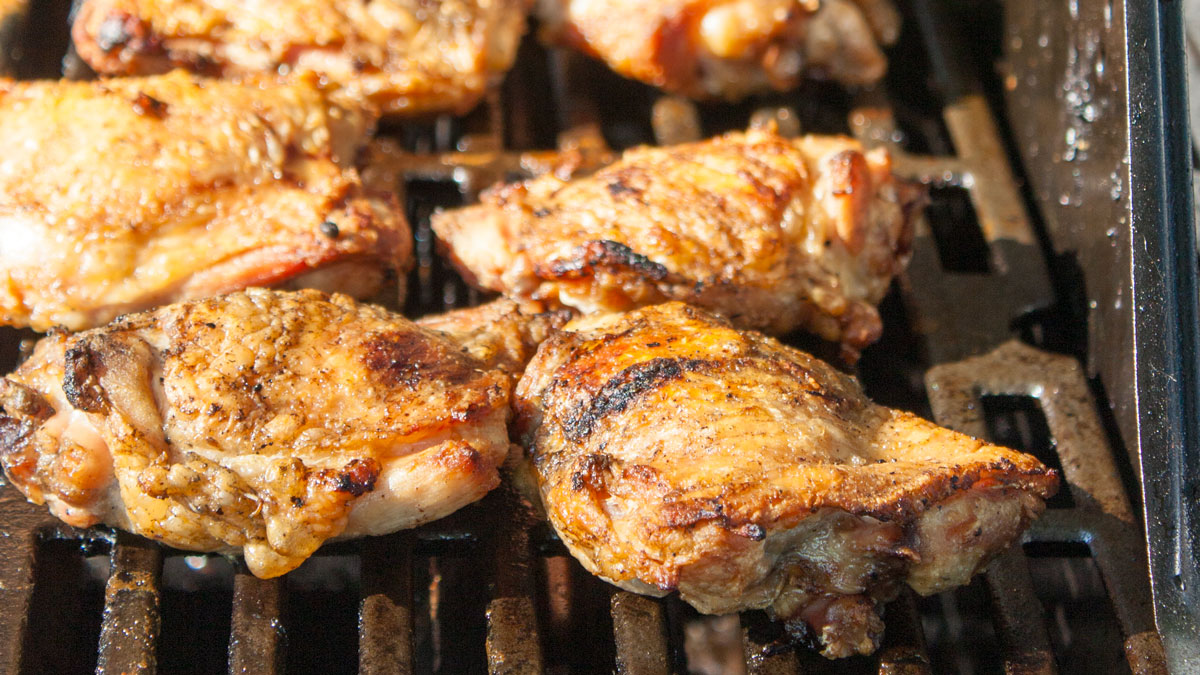 Chicken on the grill after browning.