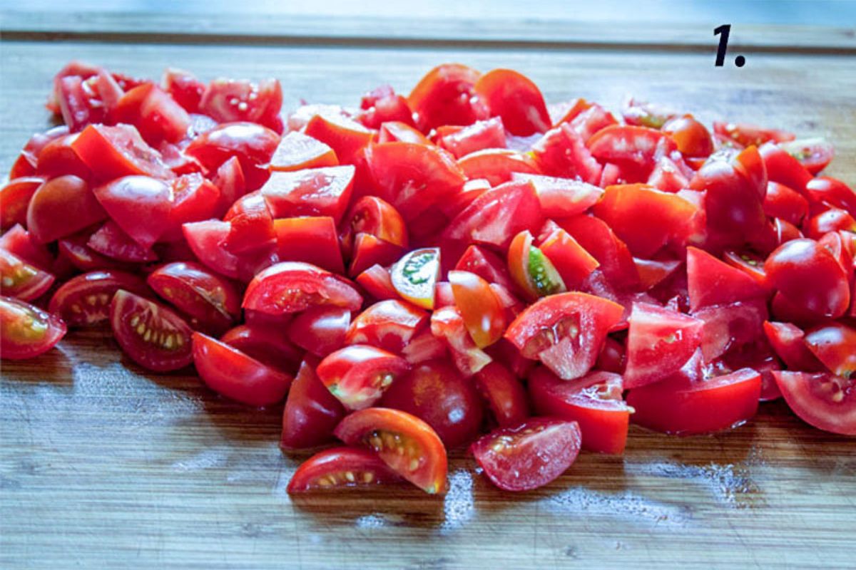 Tomatoes chopped on a cutting board.