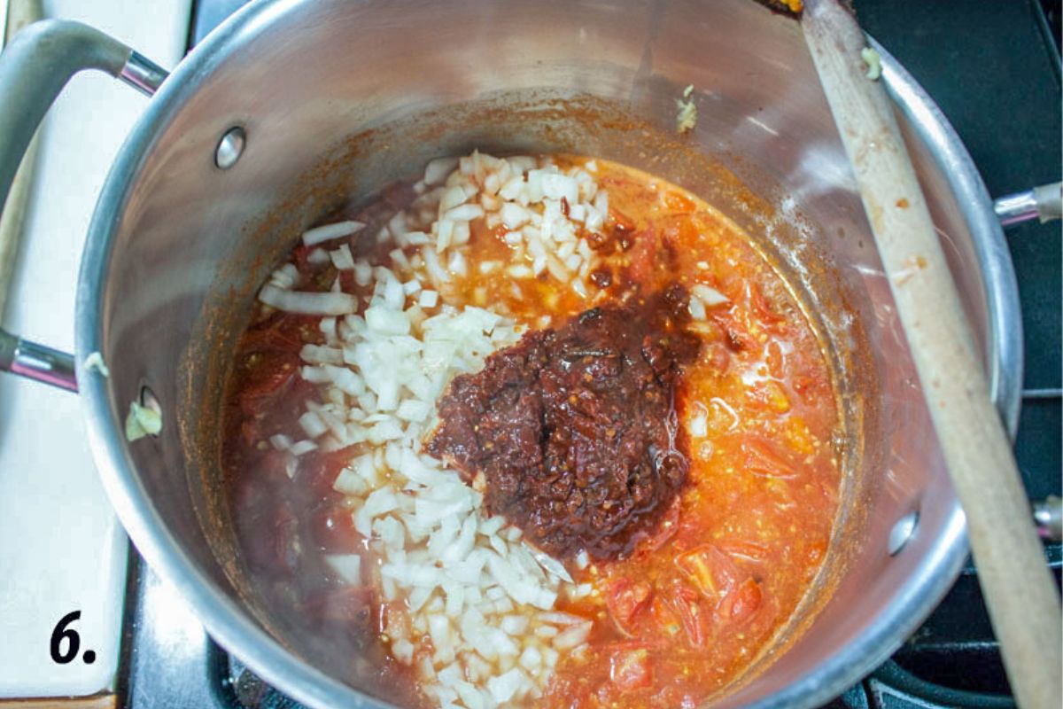 Chipotle peppers added to the pot.