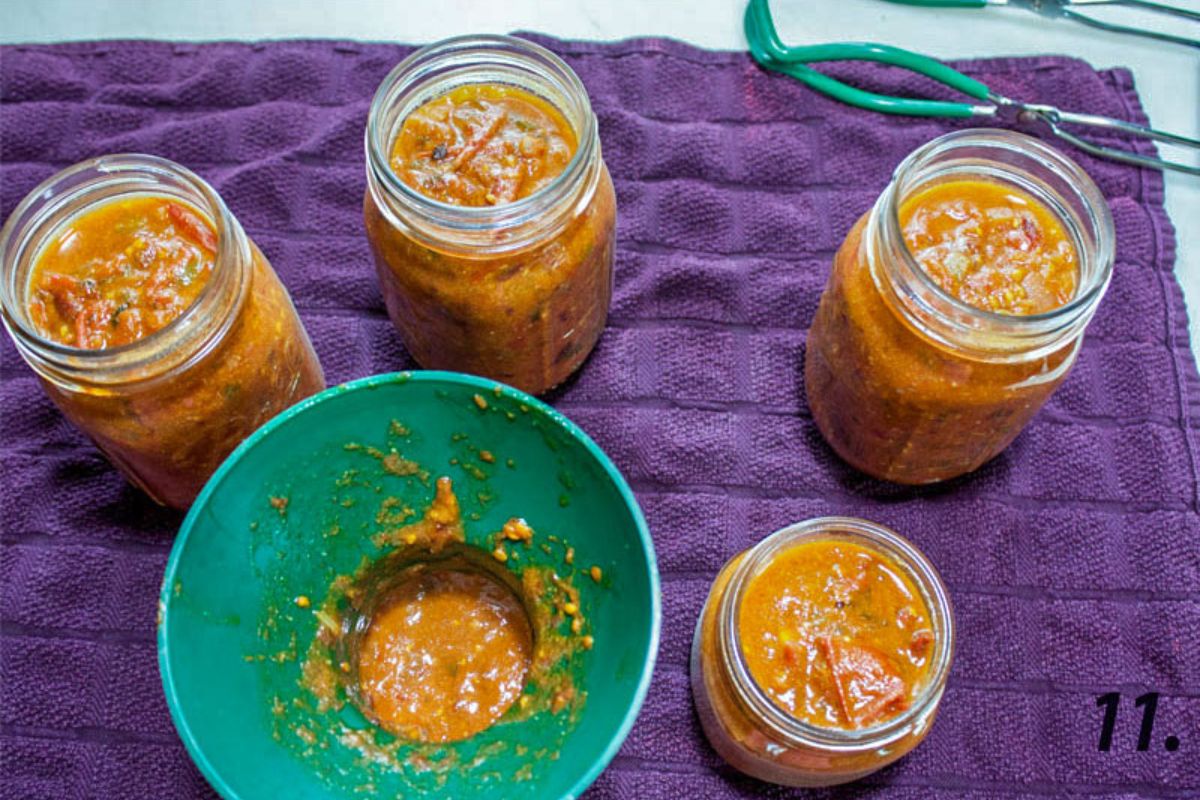 Filled jars with a canning funnel.