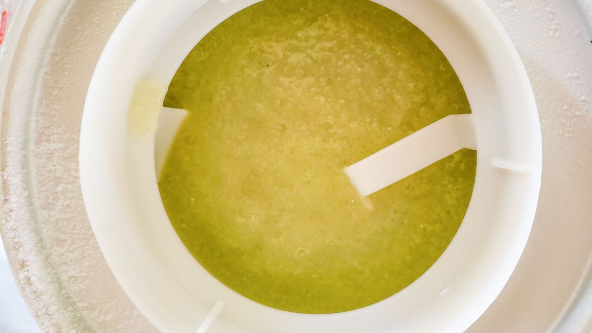 Cucumber mixture in an ice cream maker.
