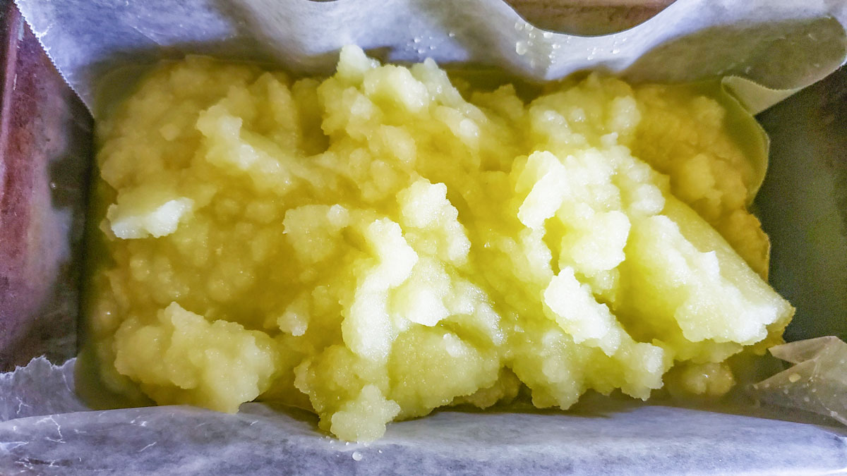 Partially frozen sorbet in a lined bread pan.
