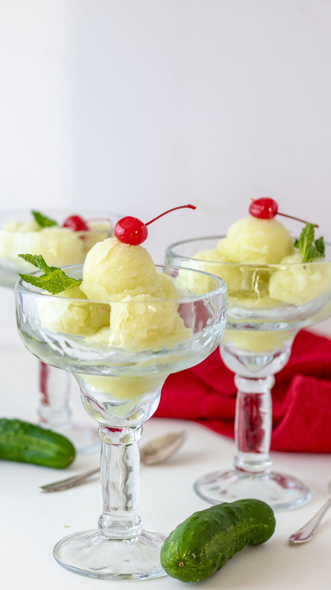 cucumber sorbet in glasses with cherry and mint.