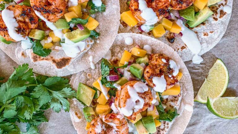 Overhead photo of three shrimp tacos.