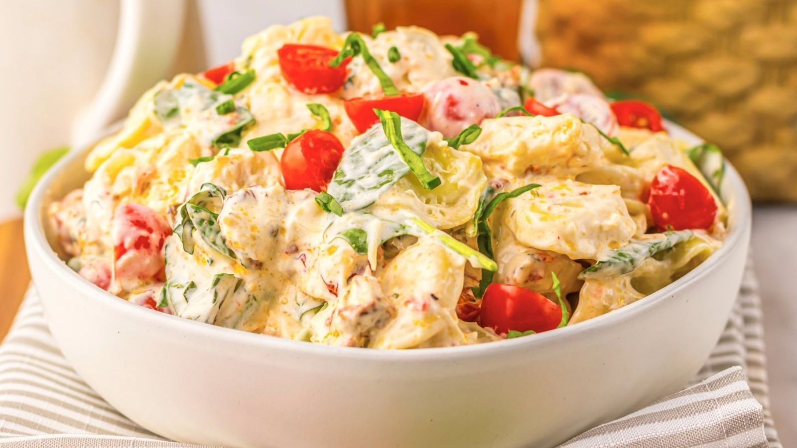 A bowl of pasta salad.