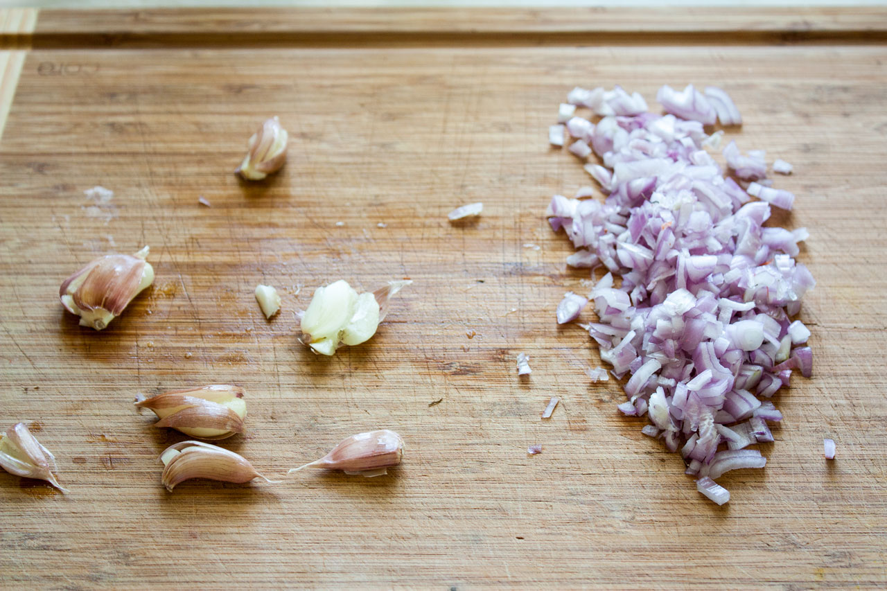 Chopped shallots on a cutting board.