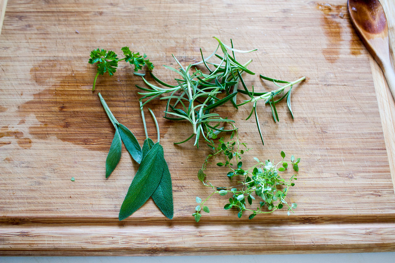 Fresh herbs chopped on the cutting board.